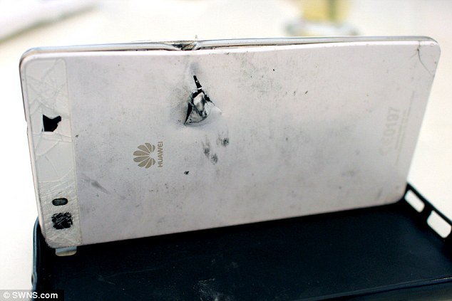 China-made cellphone saves the day: S African man survives robbery after gunman's bullet is deflected by his mobile