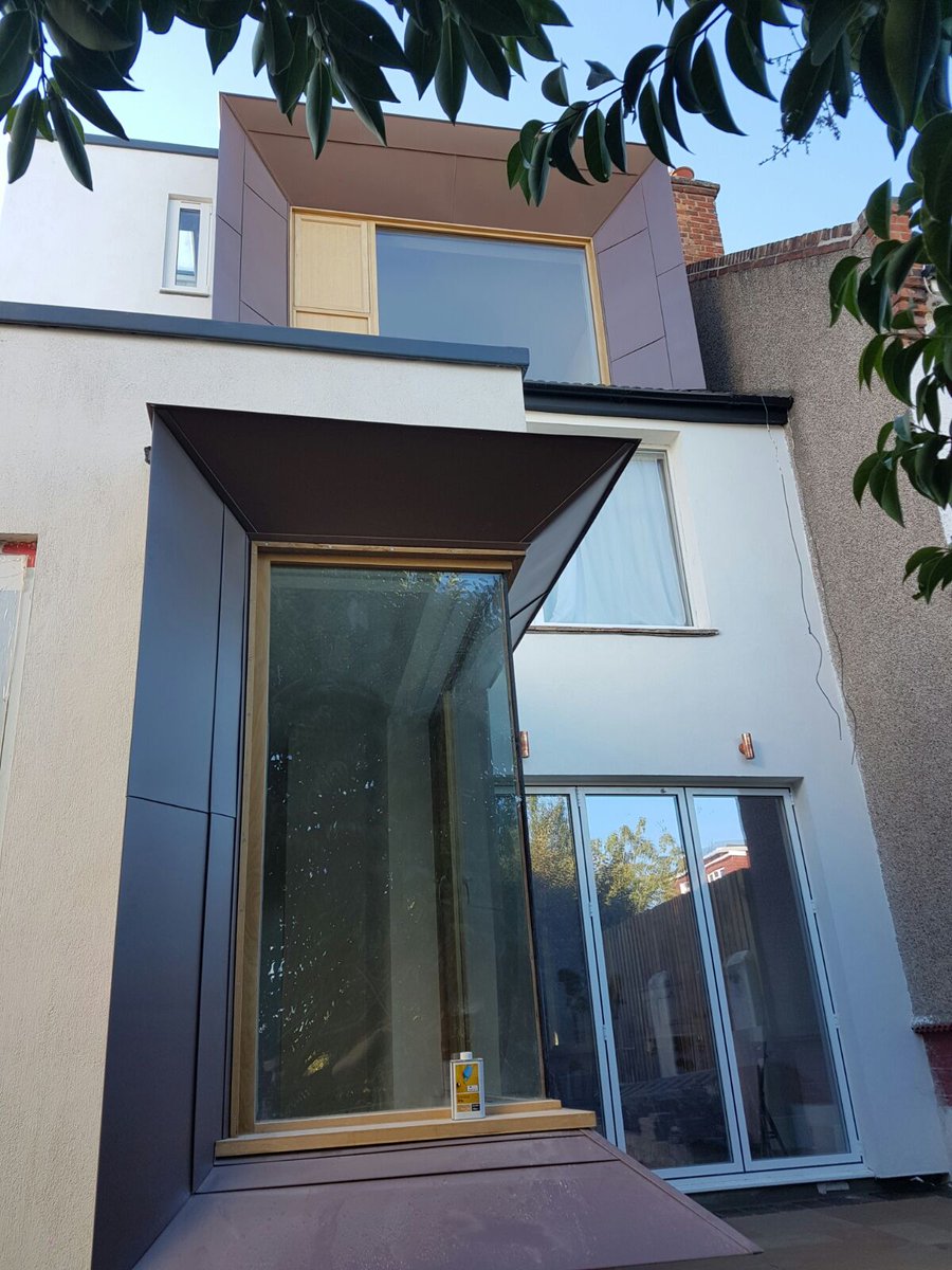 a_zeroarchitect's tweet image. Practical completion on Honour Oak Park - pigmento red Zinc portal frames around a ground floor and dormer windows
