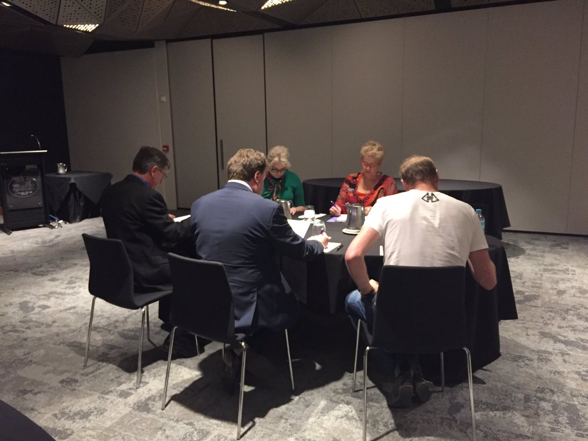 3MT_official's tweet photo. Very serious business! Judging panel hard at work 😃 #3MT https://t.co/3nekjmtCWm