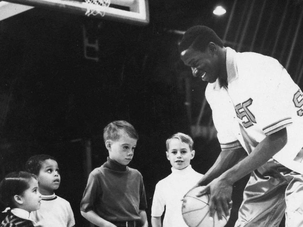 Bill Cain, who scored 1,498 career points in three seasons, talks to kids before a game. #TBT