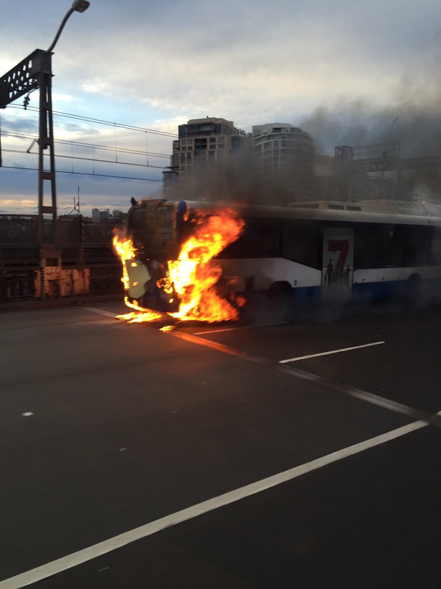 BergerLiz's tweet photo. Wow! Bus on fire in Sydney harbour bridge just now. Avoid going northbound https://t.co/ks54tveNlC