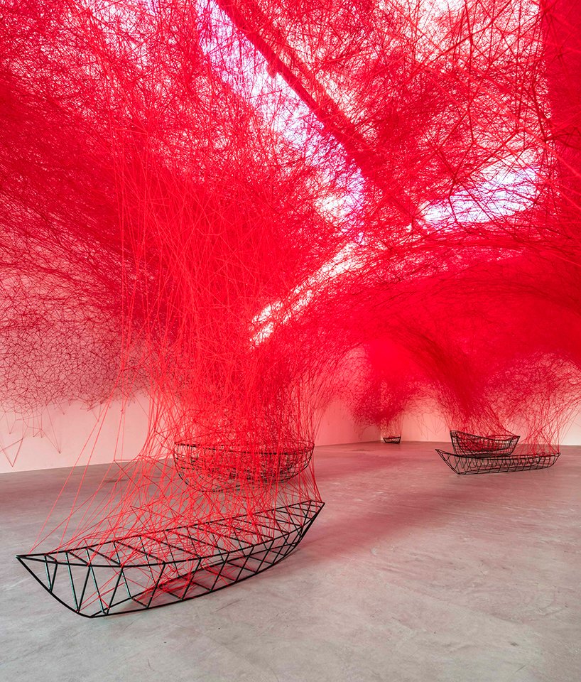 chiharu shiota tethers a labyrinth of red yarn to boat carcasses at <a href="/BlainSouthern/">Blain|Southern</a> designboom.com/art/chiharu-sh…