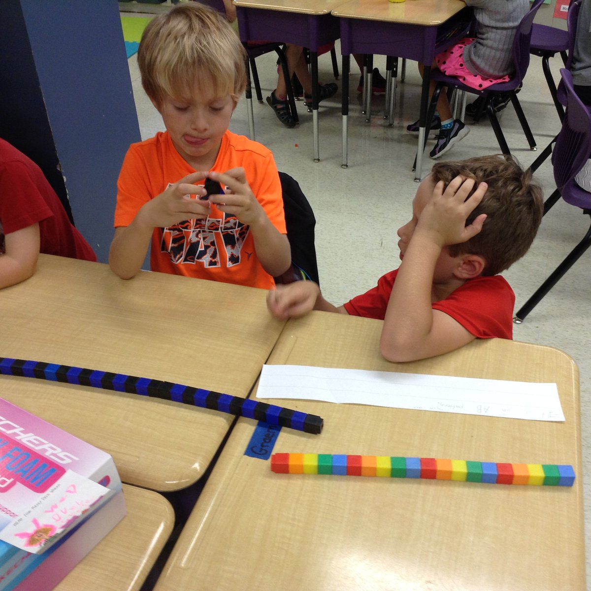 adventureclass's tweet photo. Older student helping younger student understand the core of a pattern. https://t.co/rSV0JQCpcL