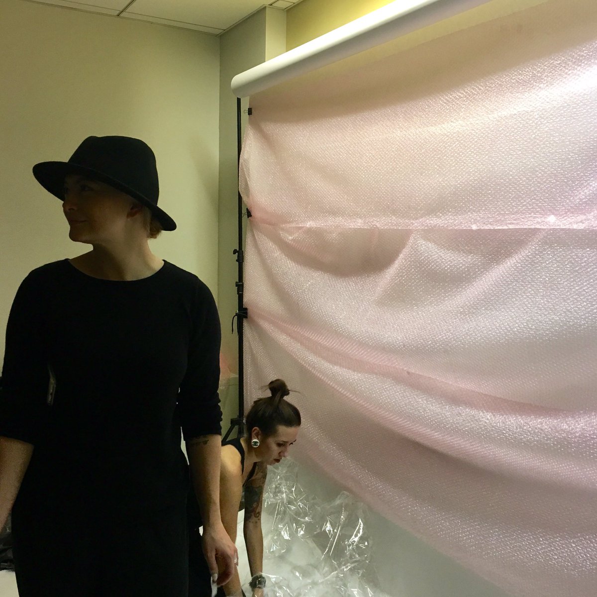 lexingtonline's tweet image. Bring in the pink bubbles! Our staff Emma and Maranda setting up the bubble wrap on set. #lexline