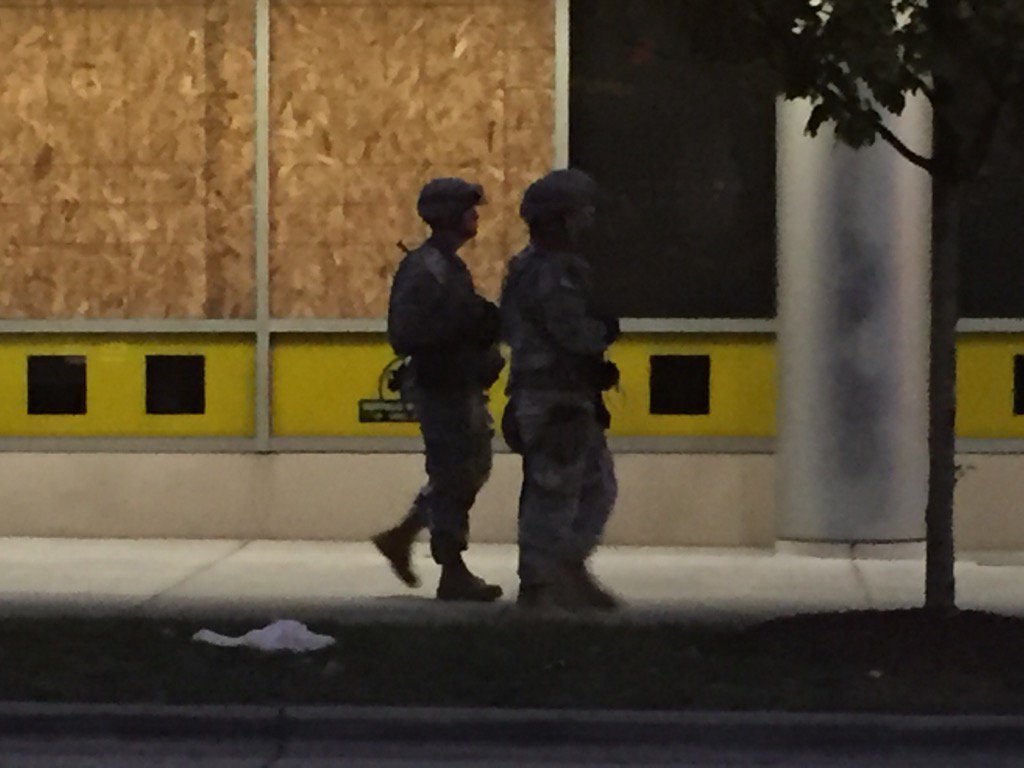 FlynnShawn's tweet photo. #BREAKING @NCNGA patrolling #cltriots with M16's in hand. @TWCNewsCLT we are live all night. https://t.co/WVhca59pi2
