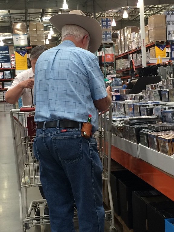pnwnd's tweet photo. my dude has a holster for his tabasco 

only at costco https://t.co/mvnZQxvkz3