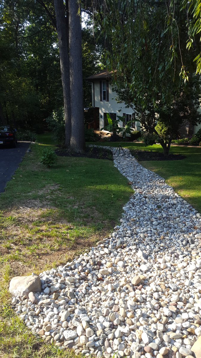 NatureDesignINC's tweet photo. Who says drainage has to look boring and take away from the look of your home. #drainageproblems #customlandscaping https://t.co/95dKmFepWX