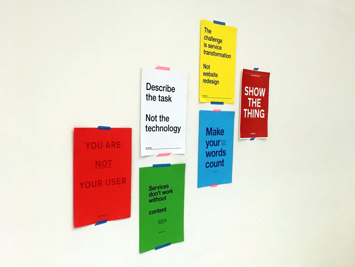 Wall of posters with GDS phrases on them