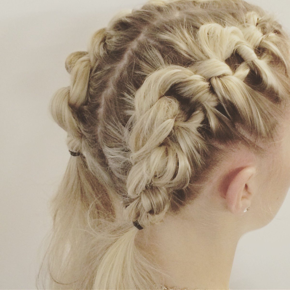 RedBeautyTeam's tweet photo. Rainy weather calls for hair up. Cue these quirky braids courtesy of @toniandguyworld for #LFWSS17 https://t.co/gLKDwzQIta