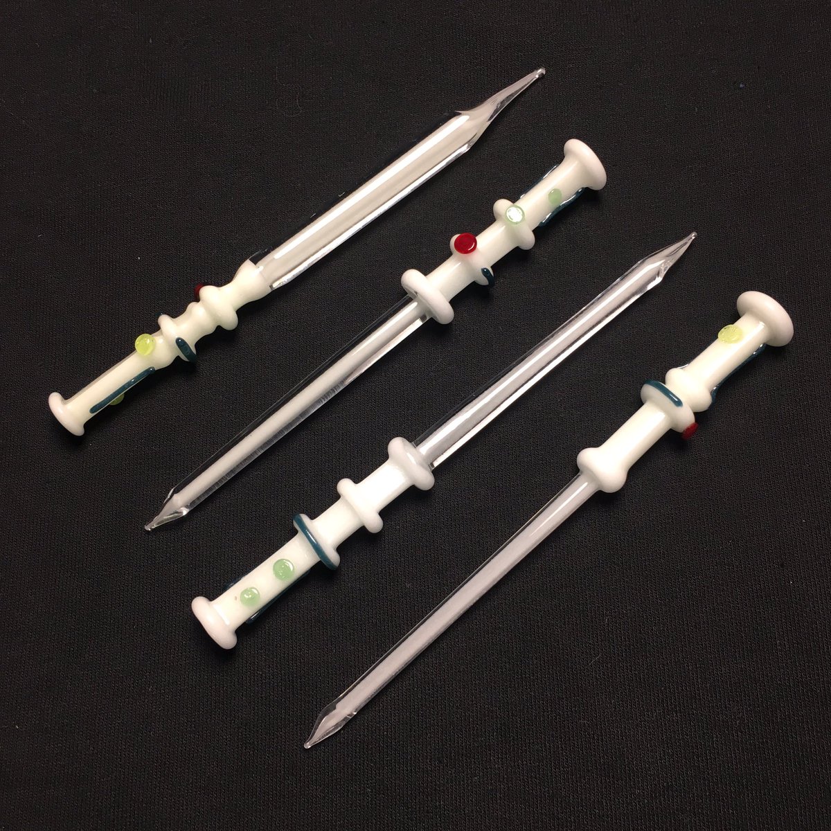 SilikaLife's tweet photo. #ShadeGlass full and half glow lightsaber dabbers available at the LA store. #silikastore #dabbers #glassart https://t.co/14mgm4LOwv