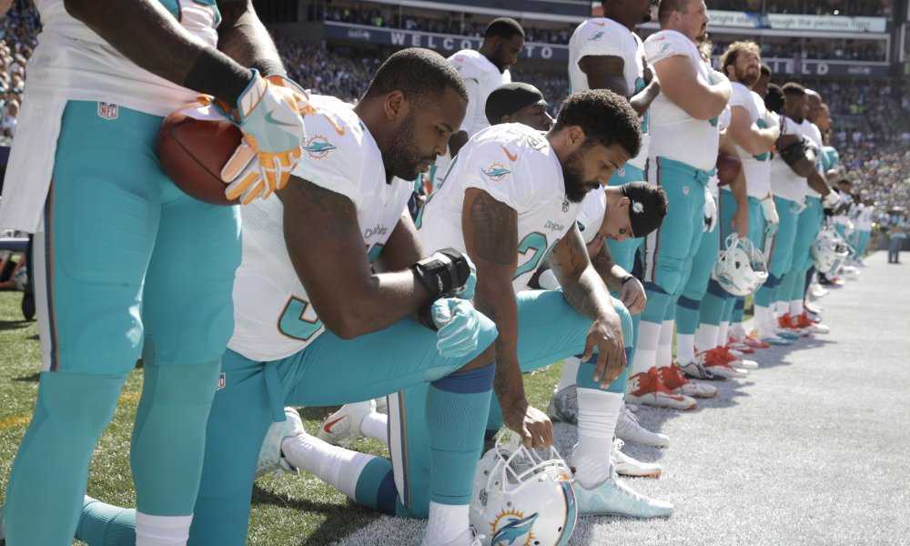 TerezOwens's tweet photo. Dolphins Fan Burn Dolphins Jerseys Over Anthem Protest https://t.co/9lzEJPnHIA  … https://t.co/JlIfVGRhsH