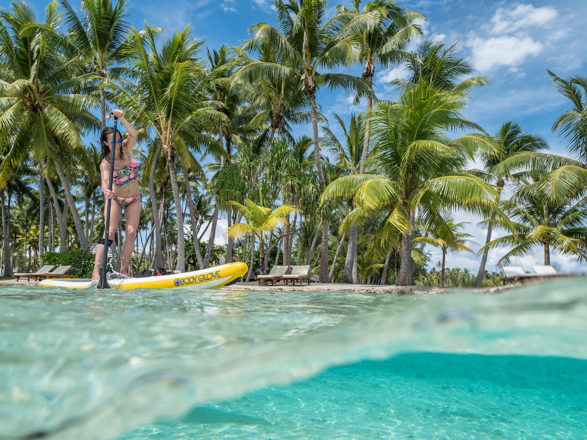 GoPaddle's tweet photo. Anne Pagano SUPing in a beautiful lagoon in @TahitiTourism #TopPaddlingDestinations @bodyglove @accentpaddles https://t.co/KKvyoRd9lG