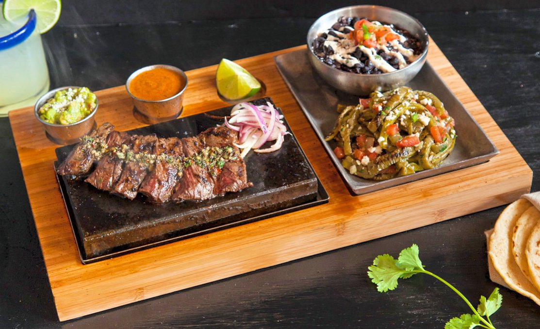 La Roca Steak. Sizzles as it cooks at your table. Have you tried it? #seattlefoodie #nomnom #moctezumas