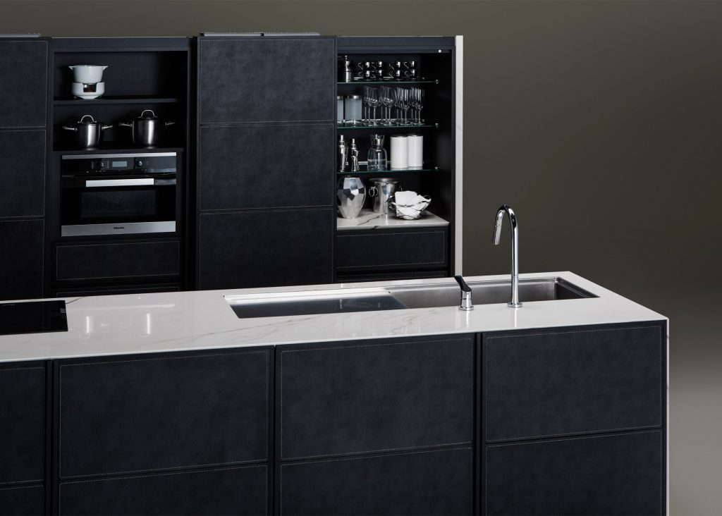 Sanwa's Kanade kitchen units feature synthetic leather cupboard doors: dezeen.com/?p=972284