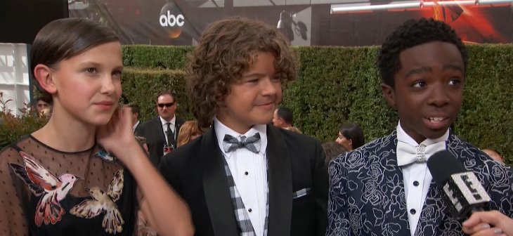 EW's tweet image. The #StrangerThings kids are melting our hearts on the #Emmys red carpet! ❤️
