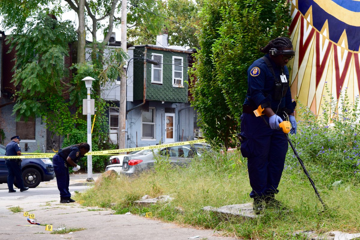 MolotovFlicker's tweet photo. Some of the double shooting scene evidence markers were in a nearby alleyway. #NormalAve https://t.co/5RbMrG28Eb