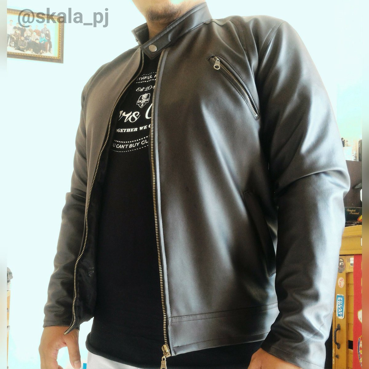 Dark brown oscar leather jacket with zipper on arm. Lets grab it