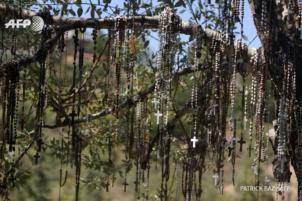 fgeffardAFP's tweet photo. LEBANON - Rosaries hang on a tree at the Christian memorial of Our Lady of Elije in Mayfouk. By @Patrick_Baz #AFP https://t.co/HgHFGnKw9E