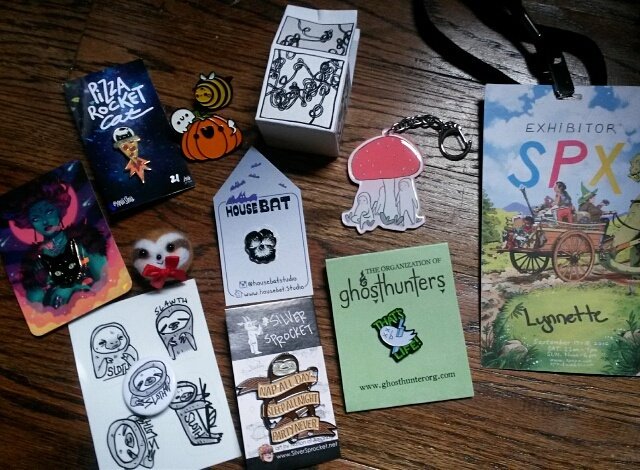 littlewhiteocto's tweet photo. @SPXcomics haul! Couldn't post it all bc I bought so many gifts! Tagged the artists I could! #SPX2016 #spx https://t.co/HP5VCCQfTx