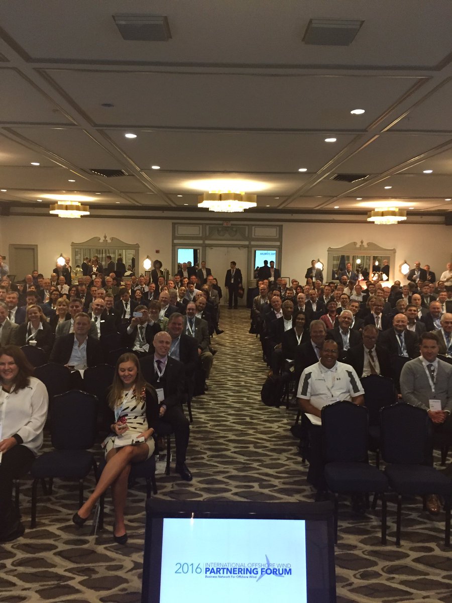 USWindInc's tweet photo. Photo from the podium and of Sen Whitehouse at the sold-out Int'l Offshore Wind Partnership forum in Newport, RI. @uswindinc https://t.co/lHnMfnG59g
