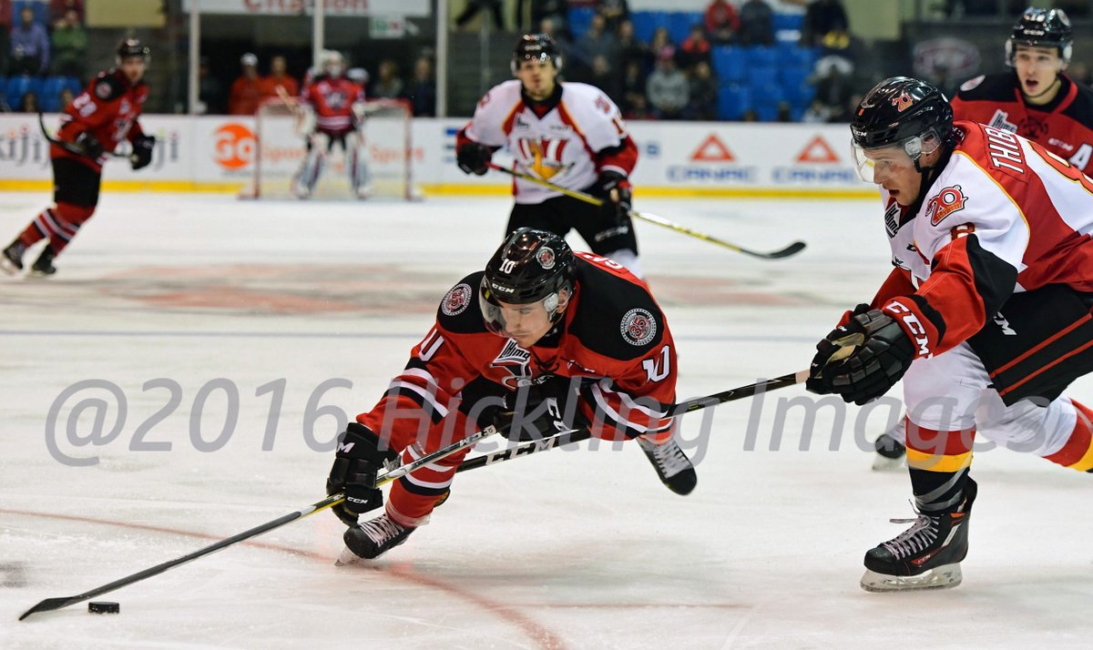 DanHickling's tweet photo. @gaumy22 of @Voltigeurs_DRU is upended by @DrakkardeBaieCo dman Samuel Thibault in Volts 6-2 win @QMJHL @mhick1953 https://t.co/0HOwwnMacN