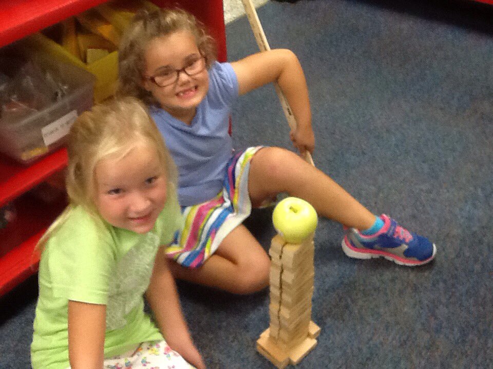 cantorclassroom's tweet image. We are building with our Jenga to see whose tower is the highest and can we balance an apple on top?