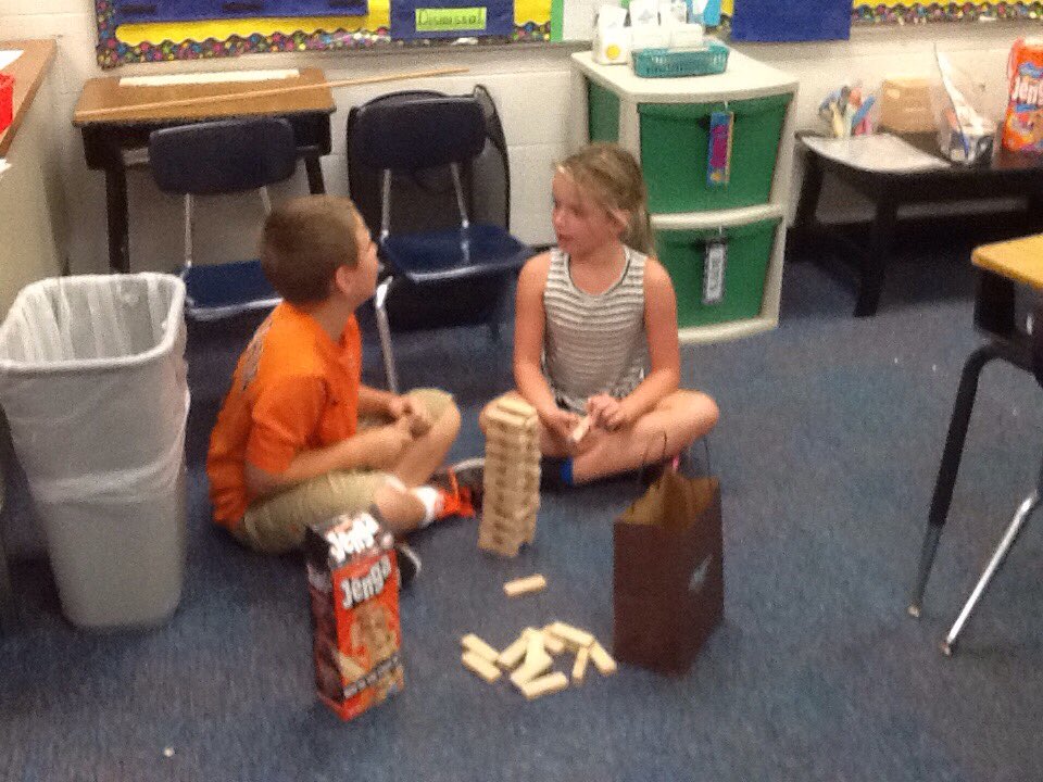 cantorclassroom's tweet image. We are building with our Jenga to see whose tower is the highest and can we balance an apple on top?