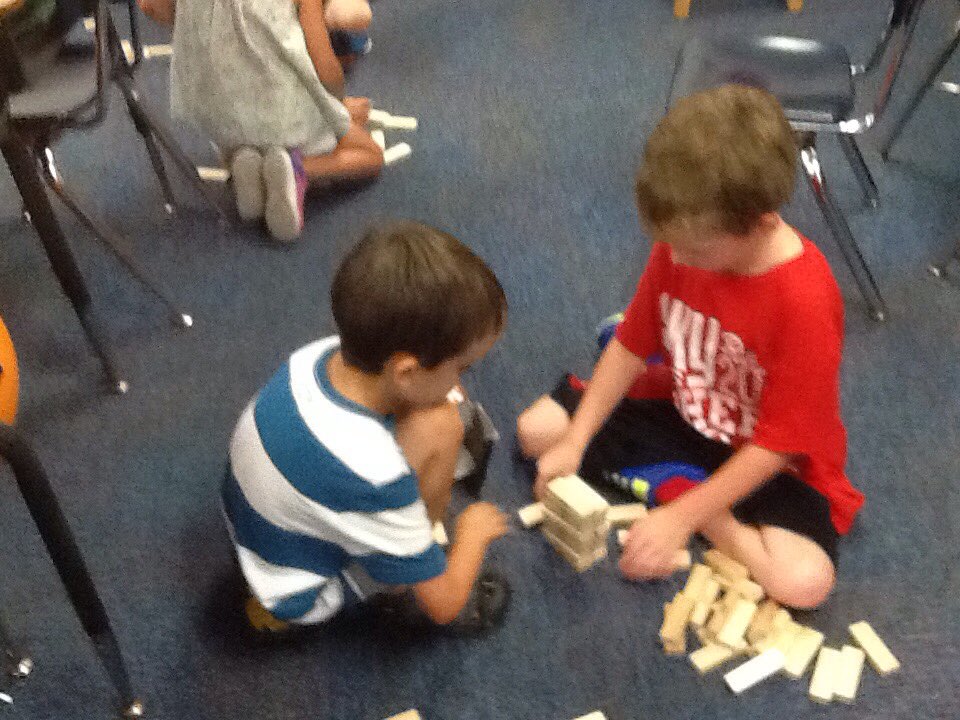 cantorclassroom's tweet image. We are building with our Jenga to see whose tower is the highest and can we balance an apple on top?