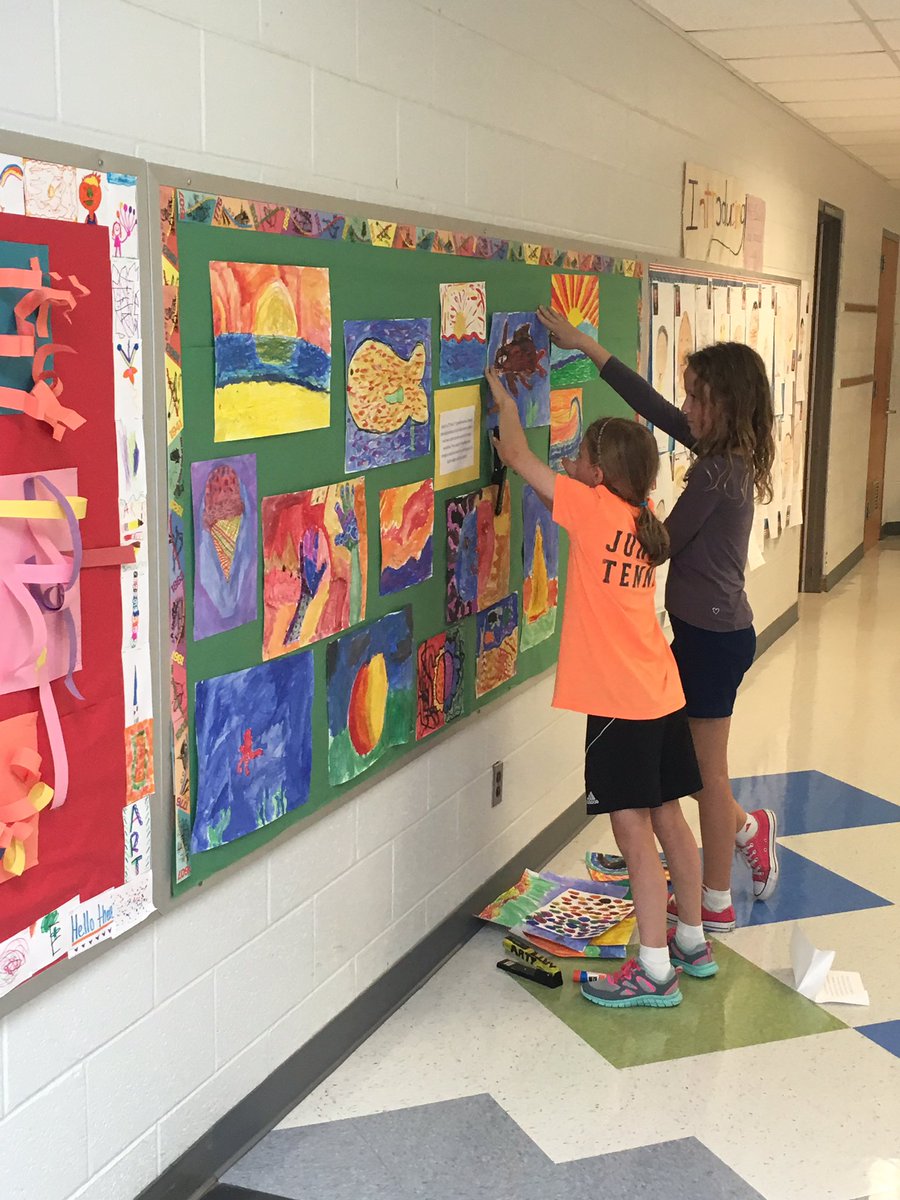 Have some great student helpers hanging artwork today! #MeriwetherLES