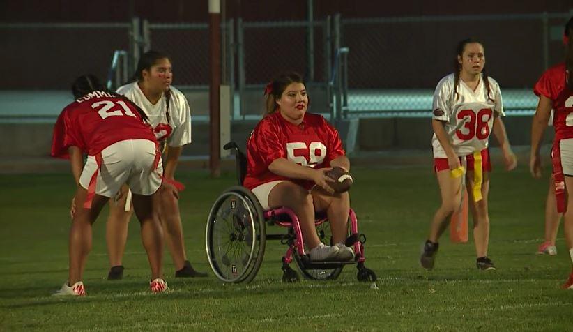 16-year-old doesn't let wheelchair keep her from playing football, cheerleading >>wmc5