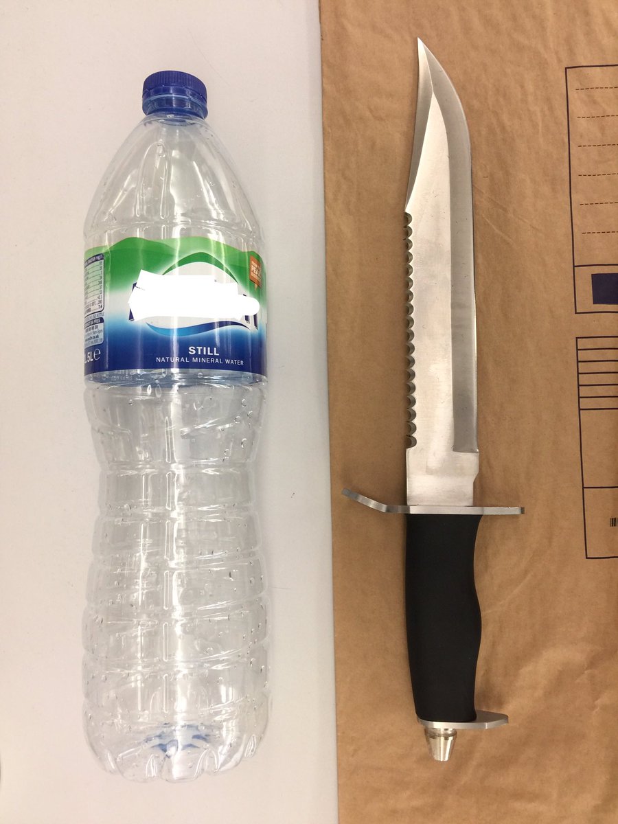MPSBrent's tweet photo. Male seen by CCTV Op's carrying huge Combat style knife! Arrested by Officers after a foot chase. (1.5L bottle of water for scale.) #ETeam https://t.co/Qe9bl78fmE