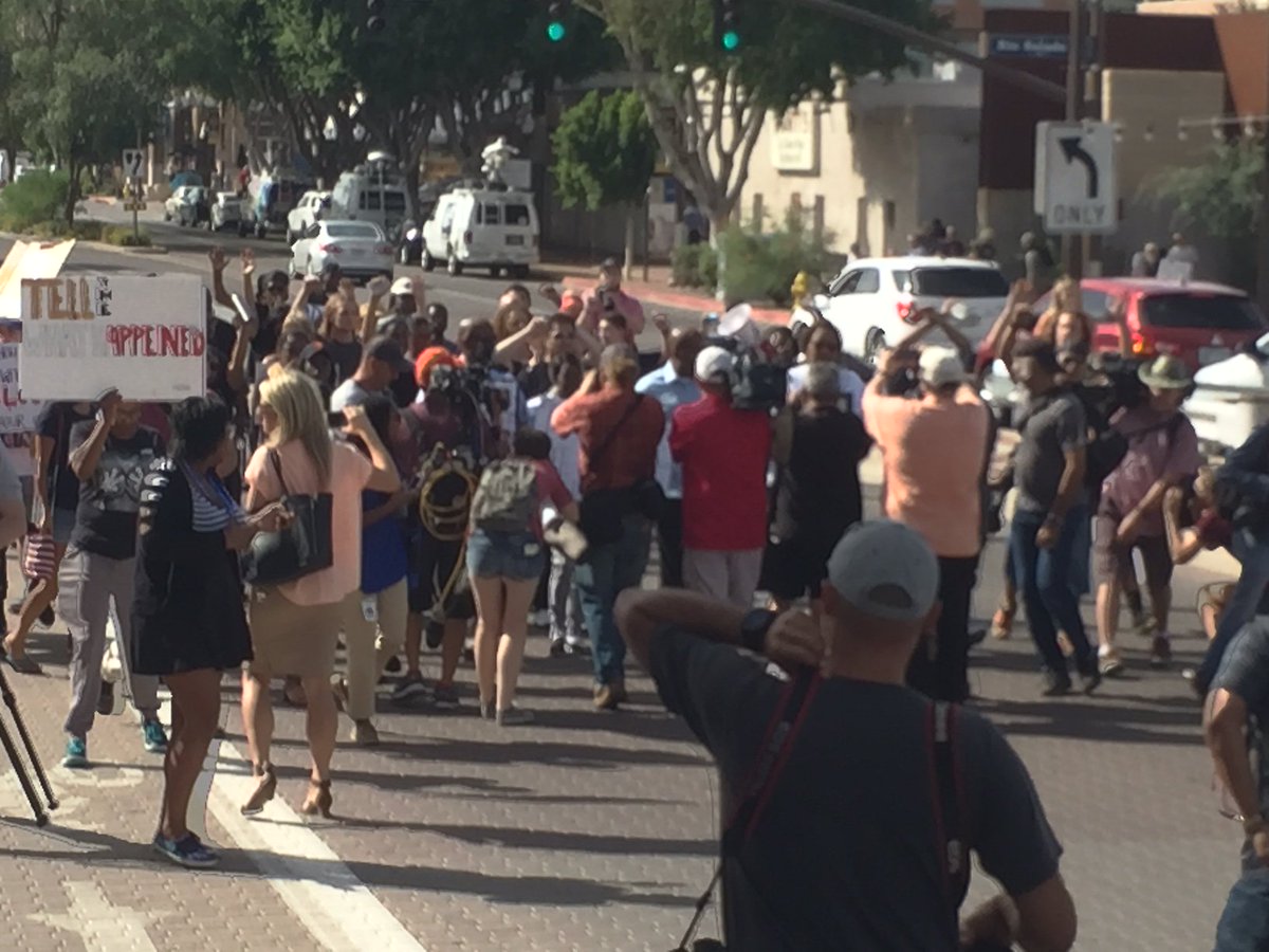 NOW: Pics from @rdavisfox10 at the Tempe Police protest. Protest organizer Mr. Maupin hauled off in handcuffs.