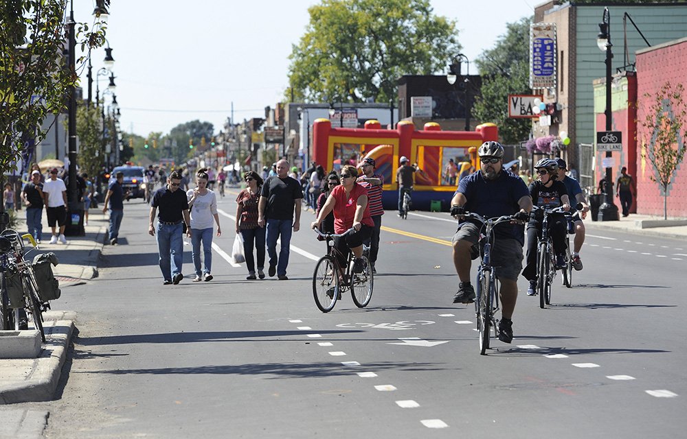 People on foot, bikes reclaim Motor City streets in Open Streets Detroit experiment.