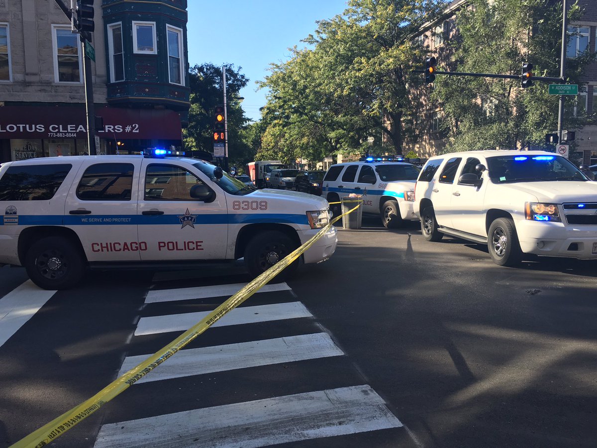 @Chicago_Police cars block body of biker killed @ Damen & Addison. Commuter witnesses shaken up @ABC7Chicago