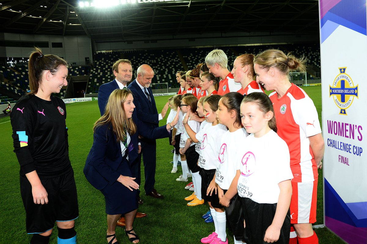 CVilleLadiesFC's tweet photo. Captain @Tiarna297 introducing the Reds team and mascots to Elaine Junk, IFA President David Martin and NI lades manager  Alfie Wylie. https://t.co/Sdg7oKsIRv