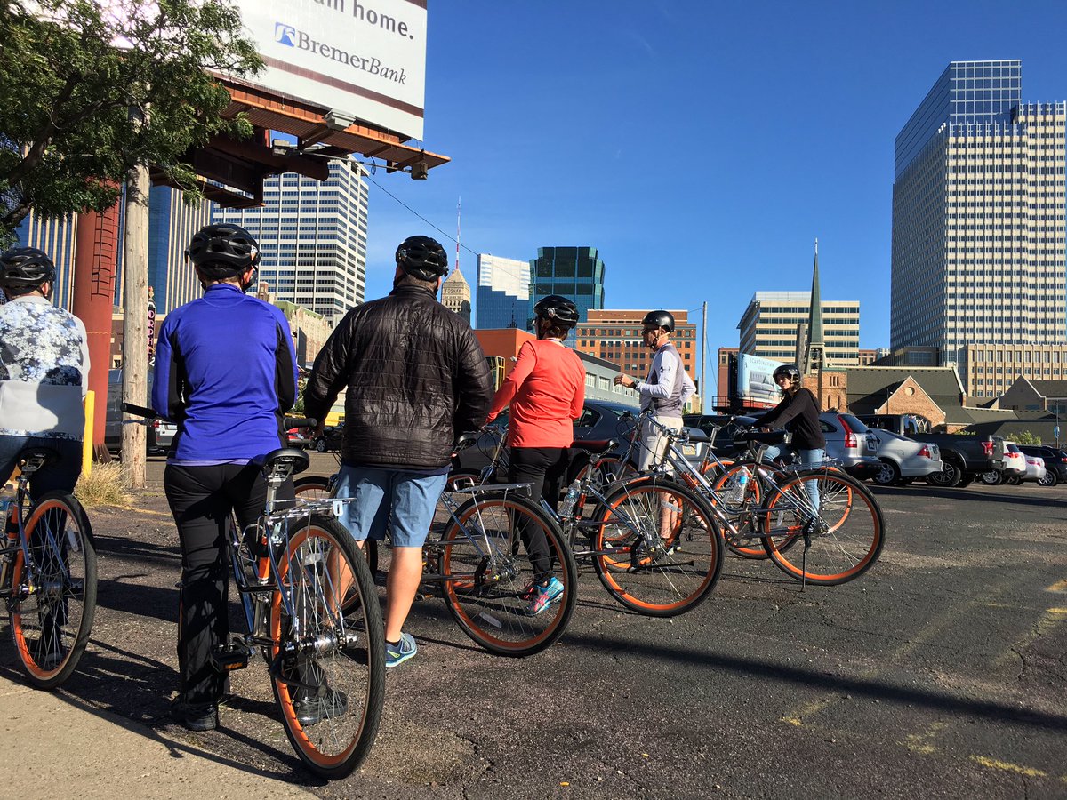 IndyChamber's tweet photo. Perfect afternoon for a bike tour through Minneapolis! Fun fact: The building on the far right is @Target's headquarters! #LEX2016 https://t.co/2L4Hndr2vw