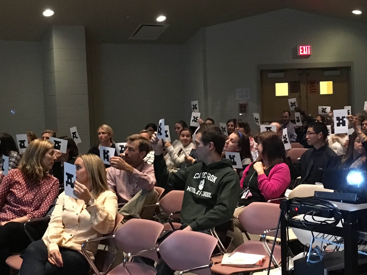 Cameron teachers answering questions using Plickers.Plickers-a simple tool that lets teachers collect real-time formative assessment data