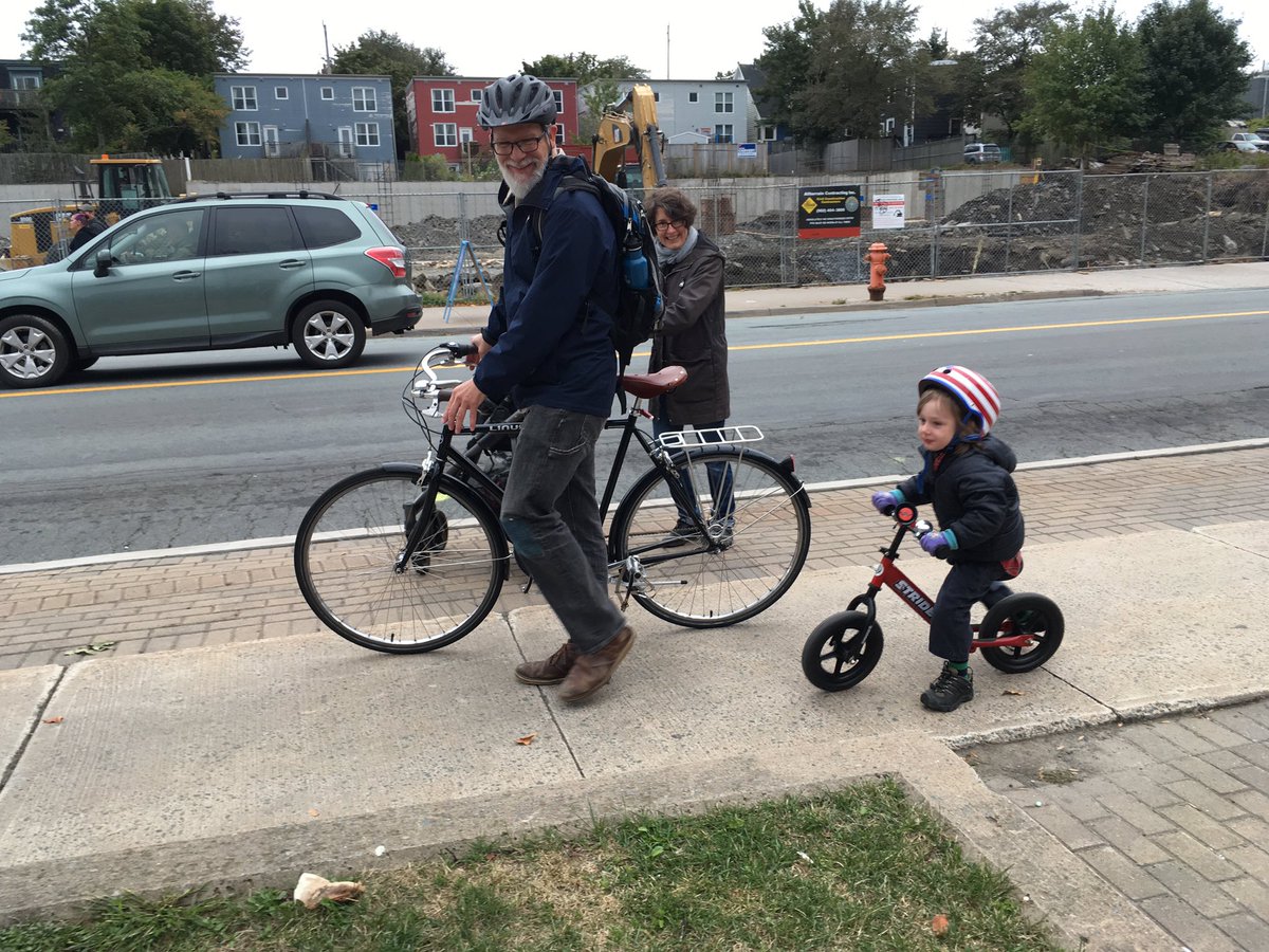 Happily on the way to daycare!  The sidewalk will have to do until we have safe bicycle lanes for her and family to ride on #desirelineshfx