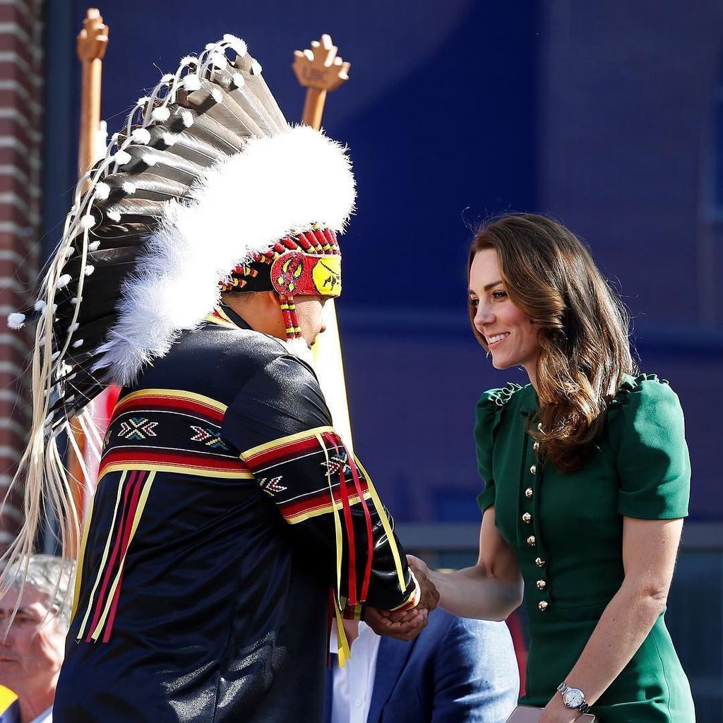 Kate Middleton shakes hands with Chief John Kruger during a ceremony at the University of …