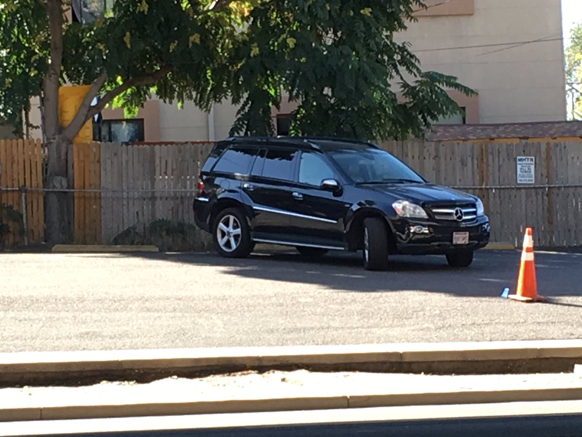 Detectives continuing investigation. Evidence marker in parking lot across the street from motel. Denver7
