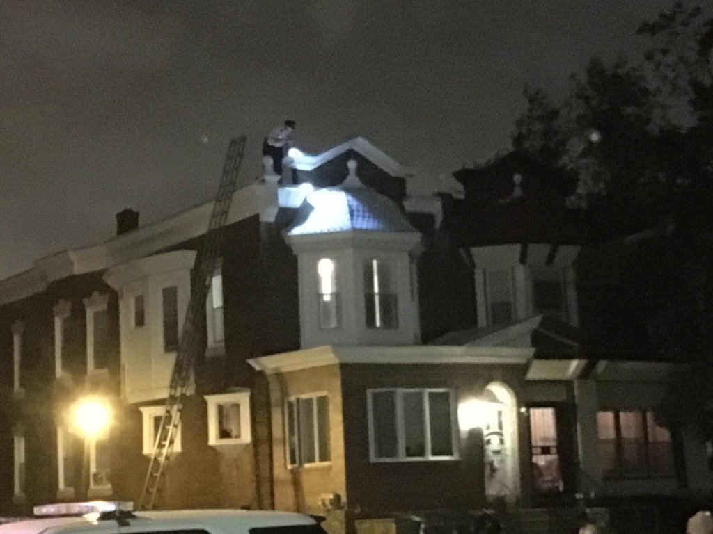 It's a bit blurry, but an officer is now searching the roof of suspects home with a flashlight. @6abc