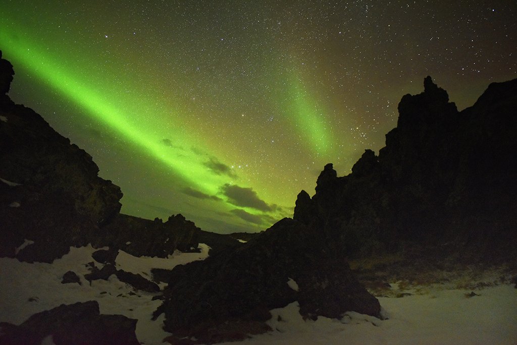 Northern Lights over lava rocks in Iceland | Photography by ©<a href="/dianasch/">Diana Schneider</a>