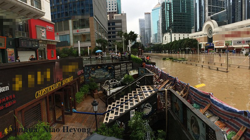 XHNews's tweet photo. Fame grows as this restaurant in China's Fuzhou survived #TyphoonMeranti, #TyphoonMegi, remained intact when the rest of the city is flooded https://t.co/5e2HyRwzfq