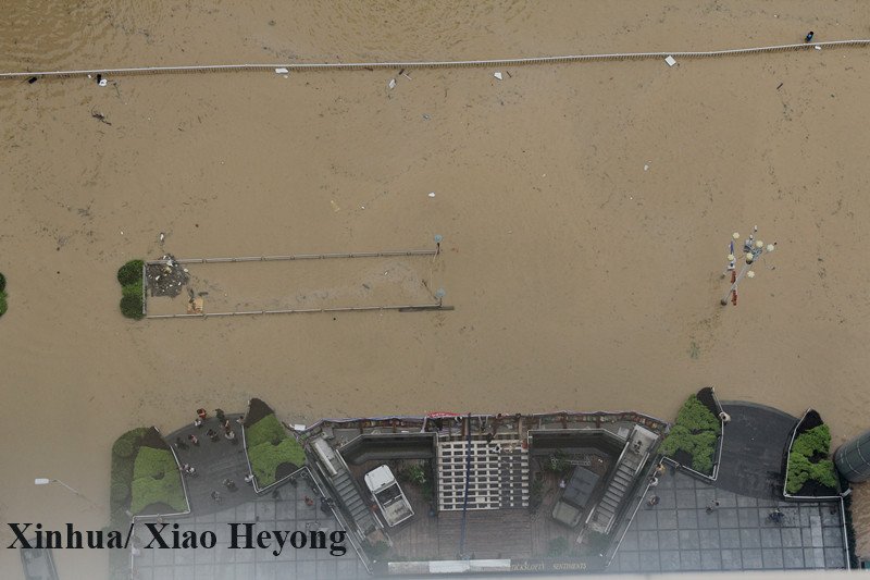 XHNews's tweet photo. Fame grows as this restaurant in China's Fuzhou survived #TyphoonMeranti, #TyphoonMegi, remained intact when the rest of the city is flooded https://t.co/5e2HyRwzfq