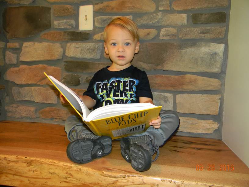 bluechipkids's tweet photo. Paxton reading #BlueChipKids. Is never too early to start learning! #smartkids #iamabluechipkid #financialliteracy #finance @WPBT2 @WXELTV https://t.co/XVOS4n5QLx