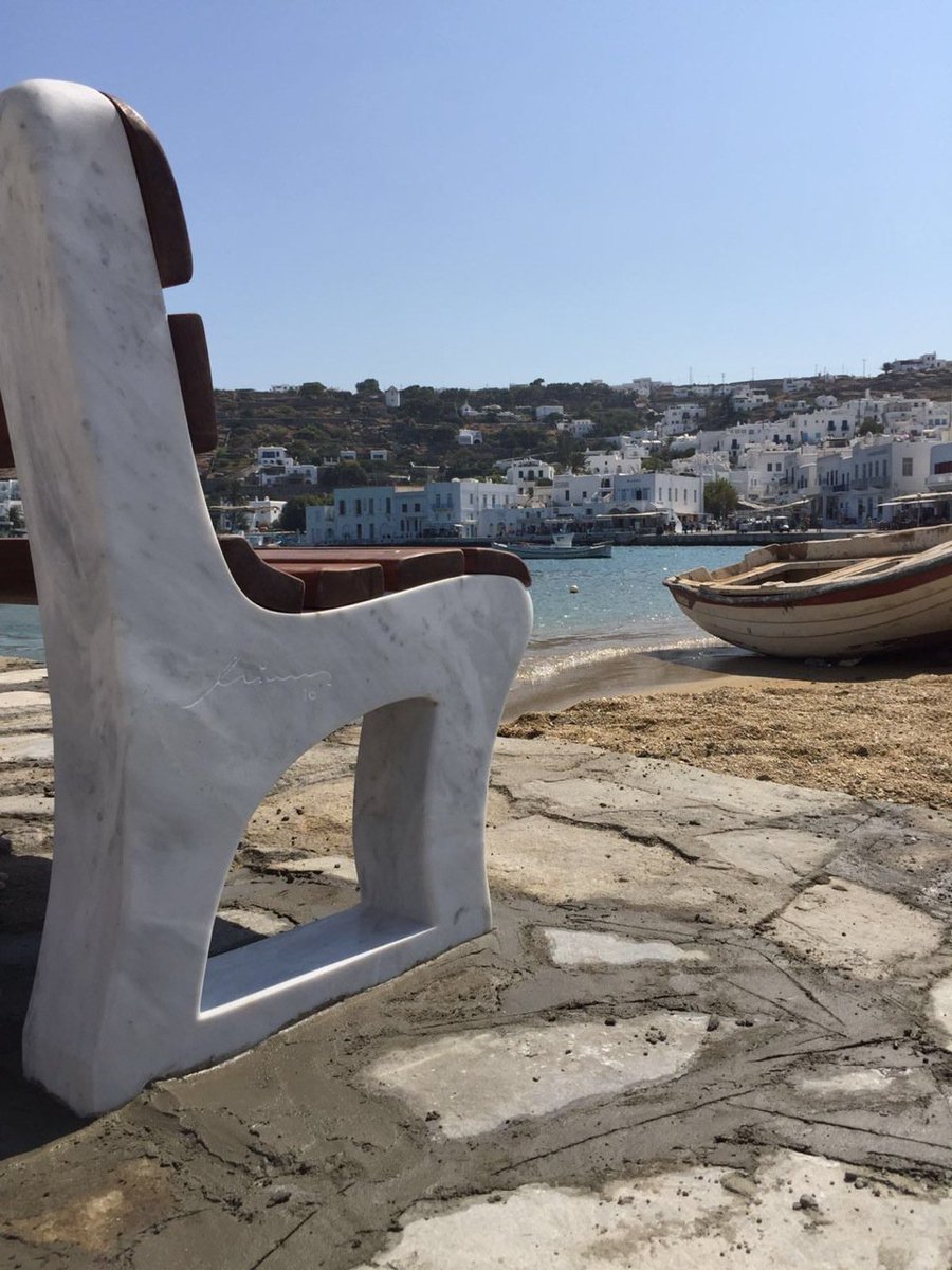 Yatzer's tweet photo. The Municipality of Mykonos has commissioned Greek designer Minas to create a custom-designed bench and lamppost (.) https://t.co/5c65yXR4rW https://t.co/V5NinbmewE