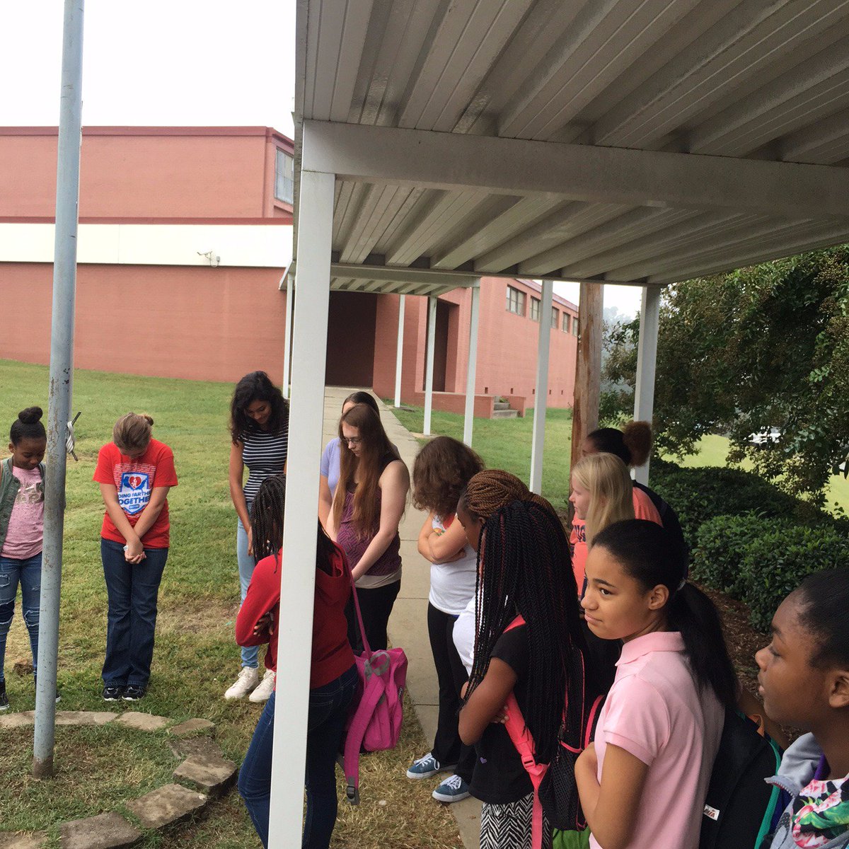 Penn-Griffin School for the Arts students praying together at "See You at the Pole" yesterday.