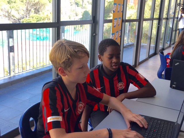 AntoniaSAshton's tweet image. Just off the soccer pitch and time for concentrated teamwork as kids build their #KickandCode app for tomorrow's judging @AfricaCodeWeek