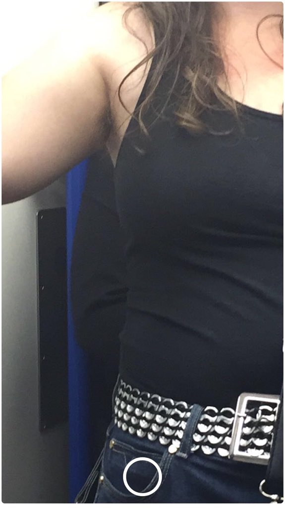 Bshface's tweet image. Rubbish pic: girl on the tube wearing a vest top with hairy armpits. I'm feminist but this is just too much #shaveyourpits