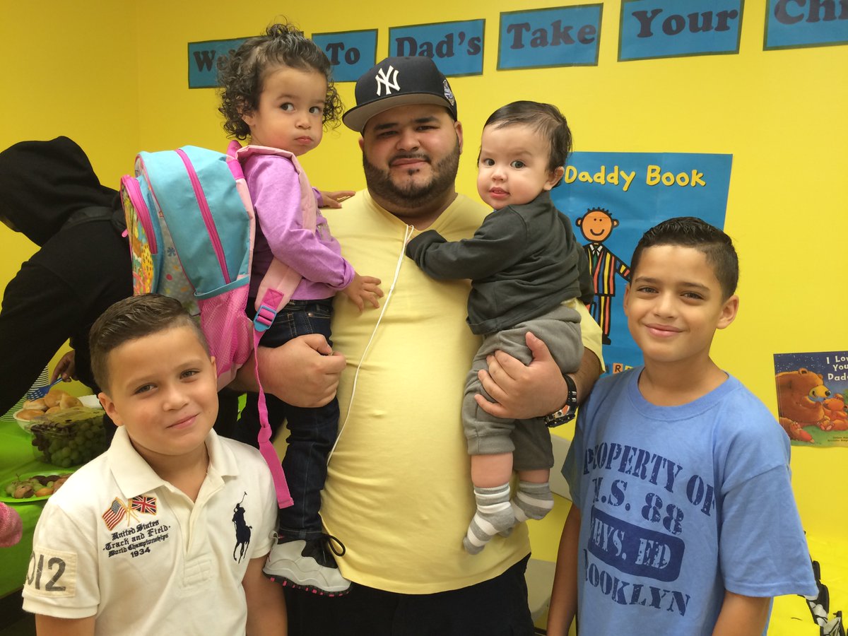 PSCHeadStart's tweet photo. #Dads and #students checked out our Wall of Pictures to see how much they’ve grown over the years at our school! #HeadStart #DTYCTS https://t.co/3cbrxftCrJ